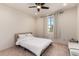 Cozy bedroom with window and ceiling fan at 23095 E Mewes Rd, Queen Creek, AZ 85142