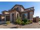 Two-story home with stone accents and a two-car garage at 23095 E Mewes Rd, Queen Creek, AZ 85142