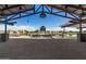 Community outdoor space with fireplace and string lights at 23095 E Mewes Rd, Queen Creek, AZ 85142