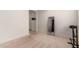 Bright hallway with a full-length mirror and exercise equipment at 23095 E Mewes Rd, Queen Creek, AZ 85142