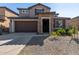 Two-story home with stone accents and a two-car garage at 23095 E Mewes Rd, Queen Creek, AZ 85142