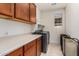 Laundry room with washer, dryer, cabinets and window at 23095 E Mewes Rd, Queen Creek, AZ 85142