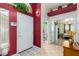 Home entryway with red walls, tile flooring, and views into bathroom and bedroom at 5830 E Mckellips Rd # 3, Mesa, AZ 85215