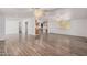 Open concept living room and kitchen with laminate flooring at 2650 W Union Hills Dr # 54, Phoenix, AZ 85027