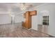 Open living room with laminate floors and ceiling fan at 2650 W Union Hills Dr # 54, Phoenix, AZ 85027