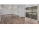 Living room with laminate wood flooring, access to patio at 2650 W Union Hills Dr # 54, Phoenix, AZ 85027