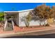 Mobile home with covered porch and access ramp,landscaped yard at 2650 W Union Hills Dr # 54, Phoenix, AZ 85027