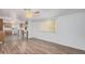 Bright kitchen with wood cabinets, white appliances, and laminate flooring at 2650 W Union Hills Dr # 54, Phoenix, AZ 85027