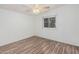 Simple bedroom with wood-look floors and ceiling fan at 2650 W Union Hills Dr # 54, Phoenix, AZ 85027