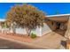Mobile home with carport and access ramp,landscaped yard at 2650 W Union Hills Dr # 54, Phoenix, AZ 85027