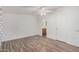 Spacious bedroom with wood-look flooring and access to bathroom at 2650 W Union Hills Dr # 54, Phoenix, AZ 85027
