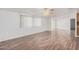 Spacious living room with laminate flooring and ceiling fan at 2650 W Union Hills Dr # 54, Phoenix, AZ 85027
