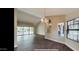 Open dining area with wood floors and access to the patio at 13035 W Ballad W Dr, Sun City West, AZ 85375