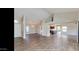 Large living area with tile floors and views of kitchen at 13035 W Ballad W Dr, Sun City West, AZ 85375