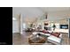 Open living area with hardwood floors, high ceilings, and modern decor at 13035 W Ballad W Dr, Sun City West, AZ 85375