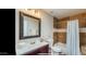 Bathroom with single sink, tile shower, and updated fixtures at 13035 W Ballad W Dr, Sun City West, AZ 85375