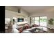Spacious living room with large sliding doors opening to a patio at 13035 W Ballad W Dr, Sun City West, AZ 85375