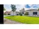 Single-story home with a spacious front yard and a two-car garage at 13035 W Ballad W Dr, Sun City West, AZ 85375