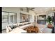 Open concept living room with a sectional sofa, coffee table, and views to the kitchen at 13035 W Ballad W Dr, Sun City West, AZ 85375