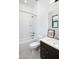 Bathroom with bathtub, toilet, and dark vanity at 812 E Summerside Rd, Phoenix, AZ 85042