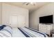 Bright bedroom with queen bed and built-in closet at 3140 E Page Ave, Gilbert, AZ 85234