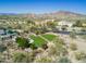 Community park with playground and seating areas, surrounded by desert landscaping and mountain views at 36021 N 32Nd Dr, Phoenix, AZ 85086