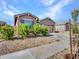 Charming house with a well-maintained front yard and driveway at 24614 N 169Th Dr, Surprise, AZ 85387
