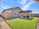 Artificial turf backyard with pergola and seating area at 24614 N 169Th Dr, Surprise, AZ 85387