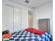 Bedroom with double doors to closet, a dresser, and a bed at 24614 N 169Th Dr, Surprise, AZ 85387