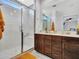 Bathroom with a walk-in shower, double vanity, and modern fixtures at 24614 N 169Th Dr, Surprise, AZ 85387