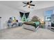 Spacious main bedroom with a large bed, dresser, and vanity at 24614 N 169Th Dr, Surprise, AZ 85387