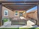 Relaxing pergola with comfortable seating and string lights at 24614 N 169Th Dr, Surprise, AZ 85387