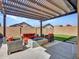 Covered patio with fire pit and comfortable seating at 24614 N 169Th Dr, Surprise, AZ 85387