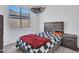 Bedroom with a bed, nightstand, and window with blinds at 24614 N 169Th Dr, Surprise, AZ 85387