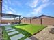 Artificial turf lawn, pergola, and patio furniture at 24614 N 169Th Dr, Surprise, AZ 85387