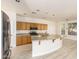 Modern kitchen featuring a large curved island and stainless steel appliances at 1384 E Morelos St, Chandler, AZ 85225