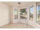 Breakfast nook with hardwood floors and large windows overlooking backyard at 1384 E Morelos St, Chandler, AZ 85225