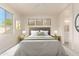 Bright bedroom with a queen-size bed, nightstands, and en-suite bathroom at 1384 E Morelos St, Chandler, AZ 85225