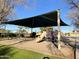 Playground with shaded structure and various play equipment for children at 1384 E Morelos St, Chandler, AZ 85225