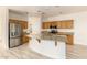 Modern kitchen with a large curved island and stainless steel appliances at 1384 E Morelos St, Chandler, AZ 85225