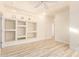 Light-filled bedroom with built-in shelving and wood-look floors at 1384 E Morelos St, Chandler, AZ 85225