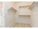 Walk-in closet with ample shelving and hanging space at 1384 E Morelos St, Chandler, AZ 85225