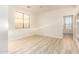 Bright bedroom with light wood flooring and ceiling fan at 1384 E Morelos St, Chandler, AZ 85225