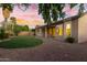 Spacious backyard featuring a grassy area and a covered patio at 1384 E Morelos St, Chandler, AZ 85225
