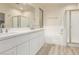 Modern bathroom with double vanity, soaking tub, and shower at 1384 E Morelos St, Chandler, AZ 85225