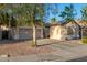 Tan house with two-car garage and mature trees in front at 1384 E Morelos St, Chandler, AZ 85225