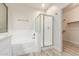 Clean bathroom with soaking tub, shower, and linen closet at 1384 E Morelos St, Chandler, AZ 85225