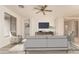 Living room with hardwood floors, comfy seating, and a large TV at 1384 E Morelos St, Chandler, AZ 85225