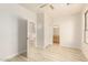 Bright bedroom with wood-look floors and access to bathroom at 1384 E Morelos St, Chandler, AZ 85225