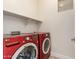 Laundry room with LG washer and dryer and additional shelving at 1384 E Morelos St, Chandler, AZ 85225
